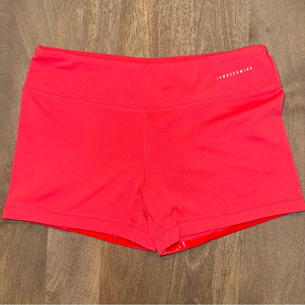 IAB MFG I AM BECOMING - Bright Coral workout shorts with no slip band.